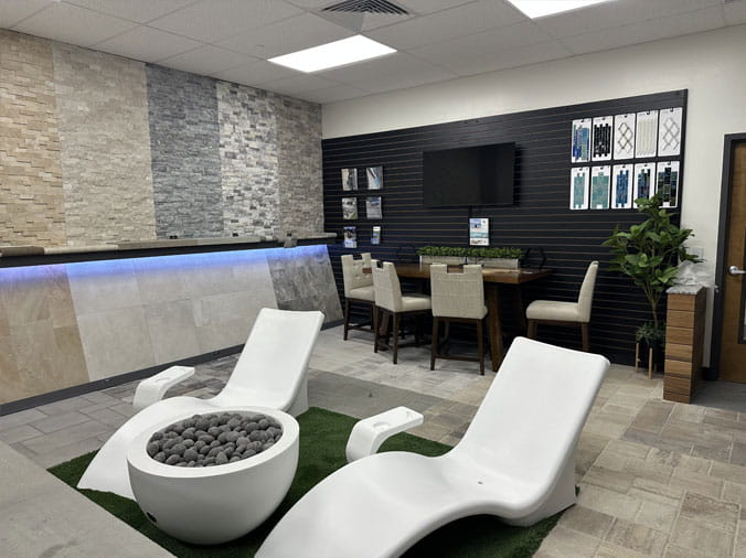 Lounge chairs and firepit in the Gorman Bay Meadows pool showroom