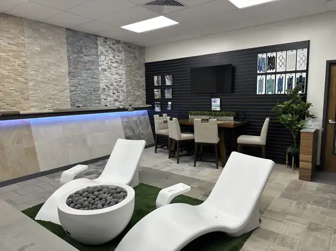 Lounge chairs and firepit in the Gorman Bay Meadows pool showroom